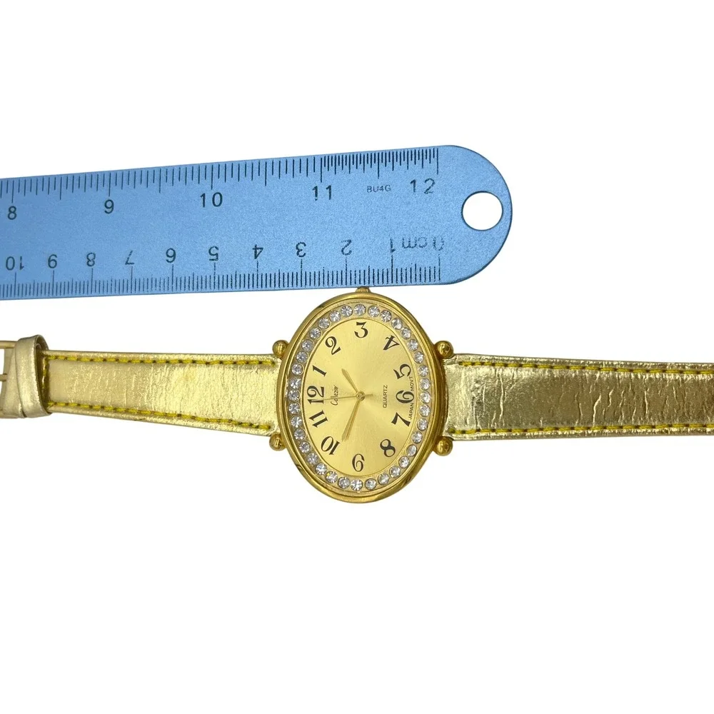Collezio Gold Tone Oval Rhinestone Bezel‎ Watch Metallic Gold Strap Japan Movt